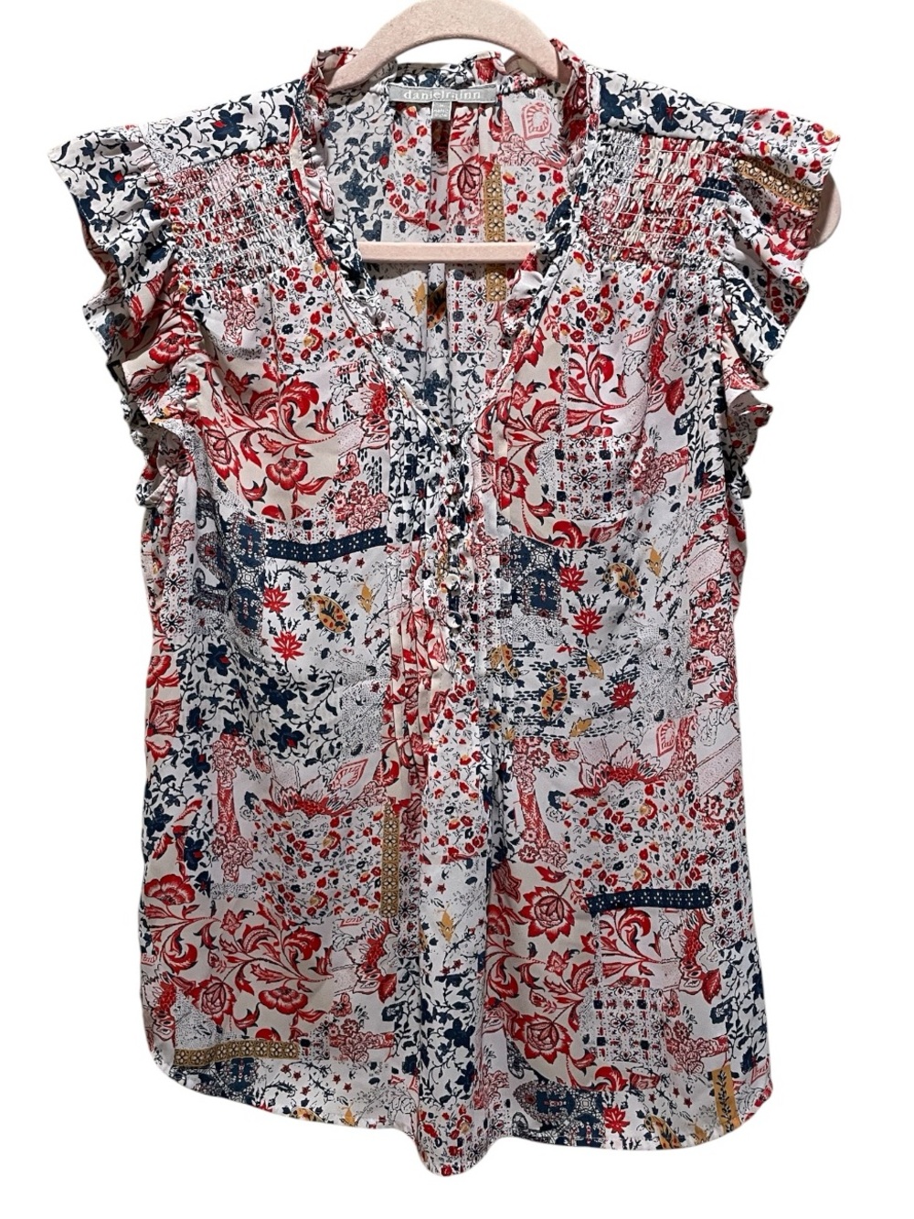 Daniel Rainn blouse patchwork floral print with ruffle cap sleeves. Size M.